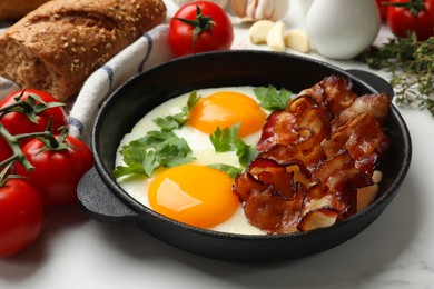 Photo of Tasty bacon, eggs and parsley on light table, closeup