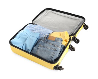 Photo of Open suitcase with clothes packed for travelling isolated on white