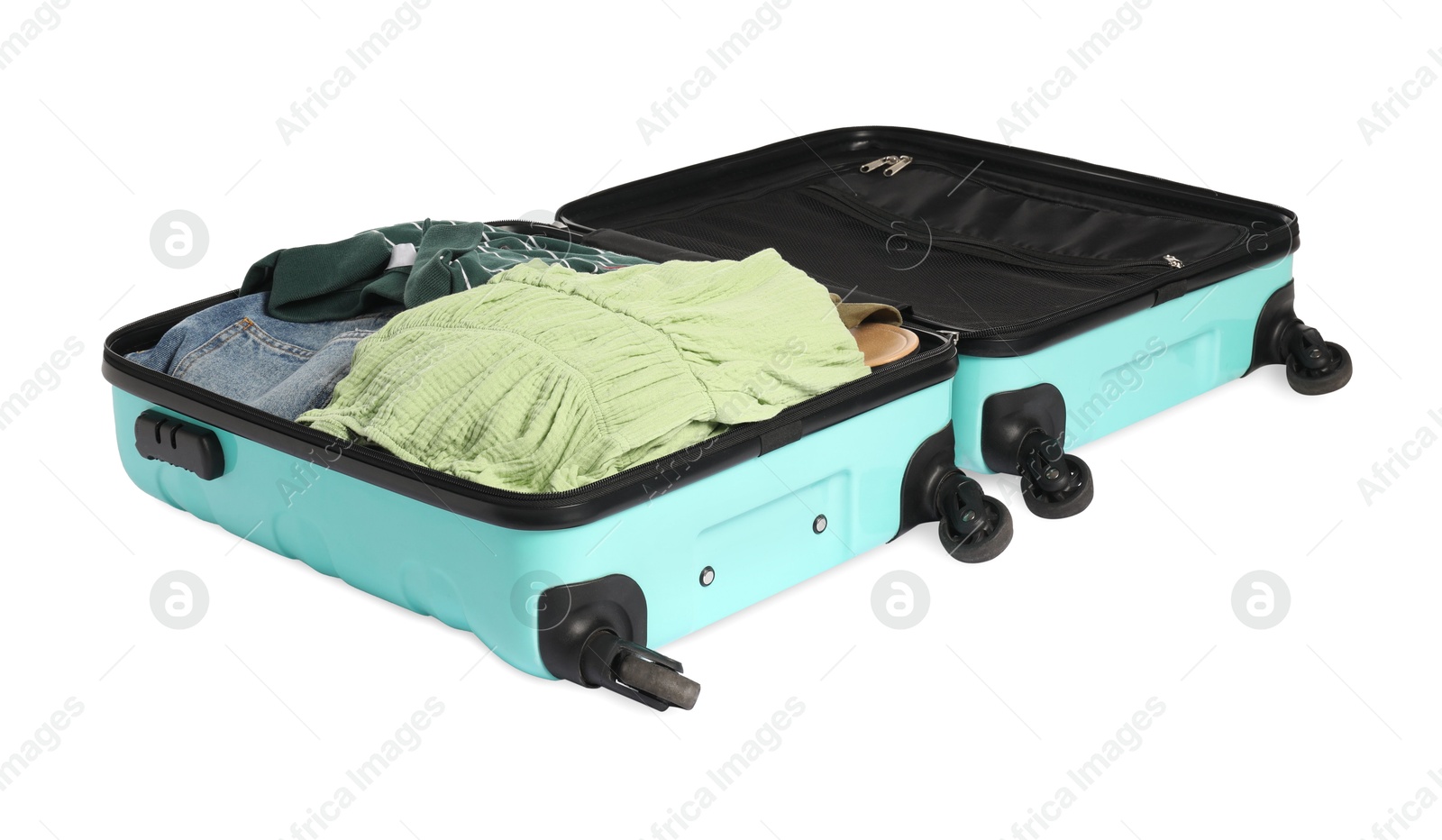 Photo of Open suitcase with clothes packed for travelling isolated on white