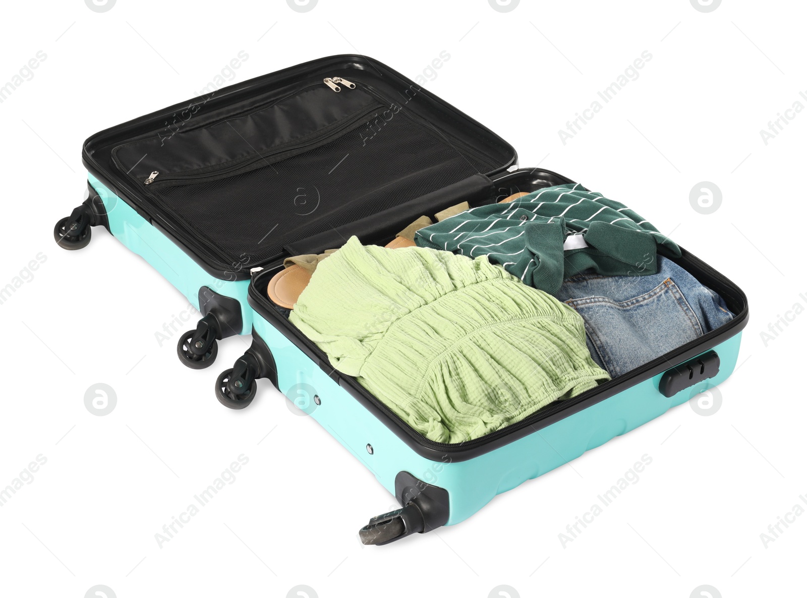 Photo of Open suitcase with clothes packed for travelling isolated on white