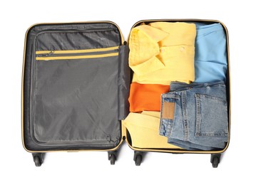 Photo of Open suitcase with clothes packed for travelling isolated on white, top view