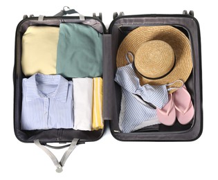 Photo of Open suitcase with clothes packed for travelling isolated on white, top view