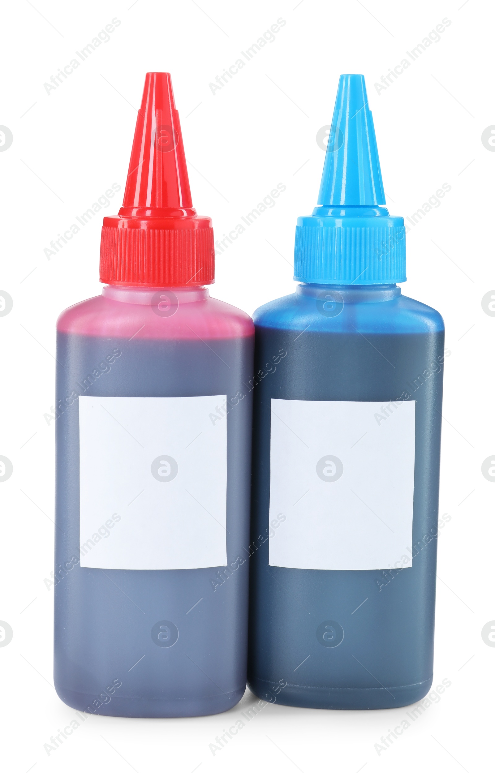 Photo of Bottles of different printer ink isolated on white