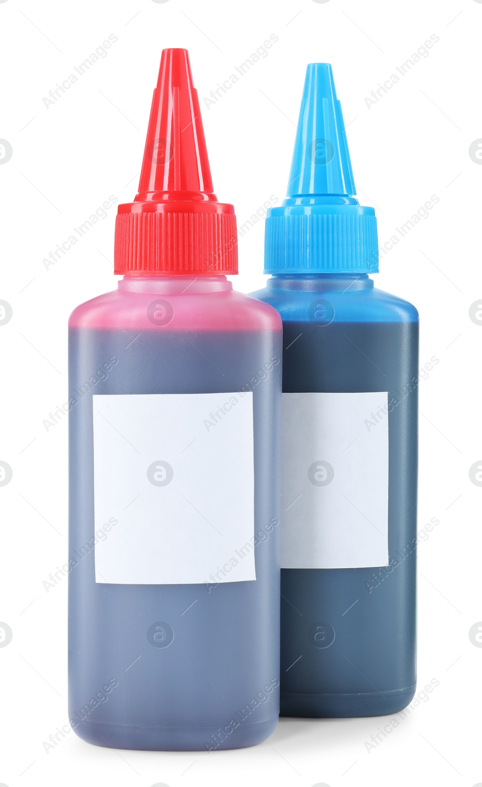 Photo of Bottles of different printer ink isolated on white