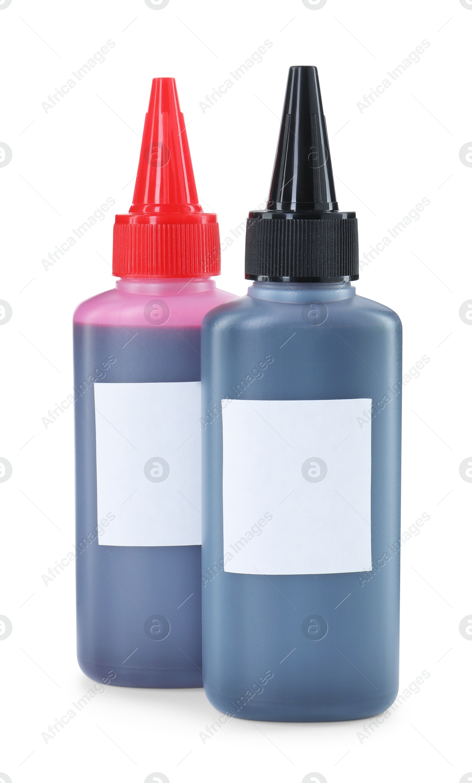 Photo of Bottles of different printer ink isolated on white