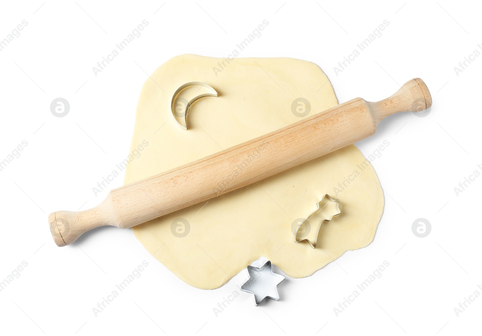 Photo of Raw dough, cookie cutters and wooden rolling pin isolated on white, top view