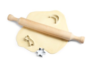 Raw dough, cookie cutters and wooden rolling pin isolated on white