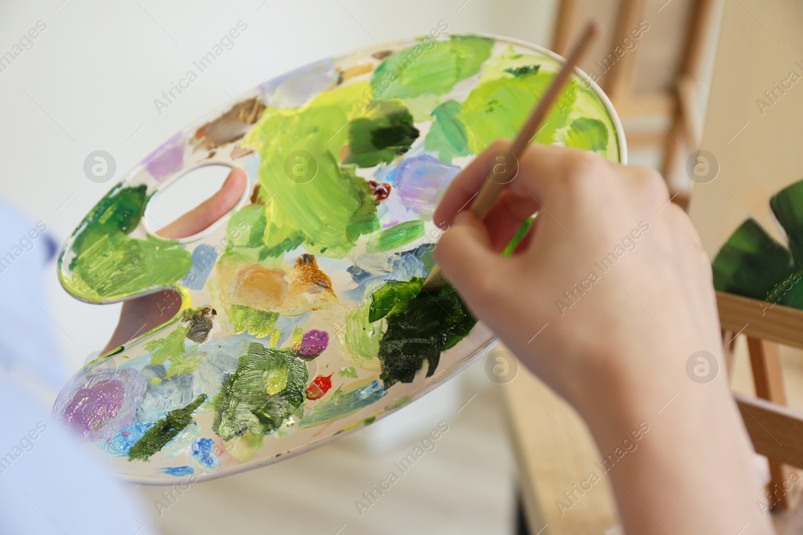 Photo of Woman with brush and palette, closeup view