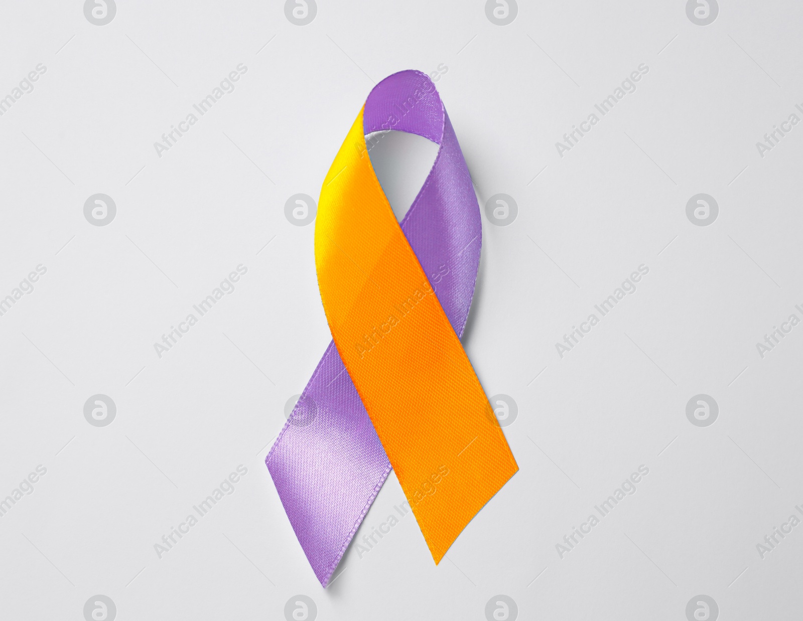 Image of World Psoriasis Day. Orange and orchid awareness ribbon as symbol of support on white background, top view