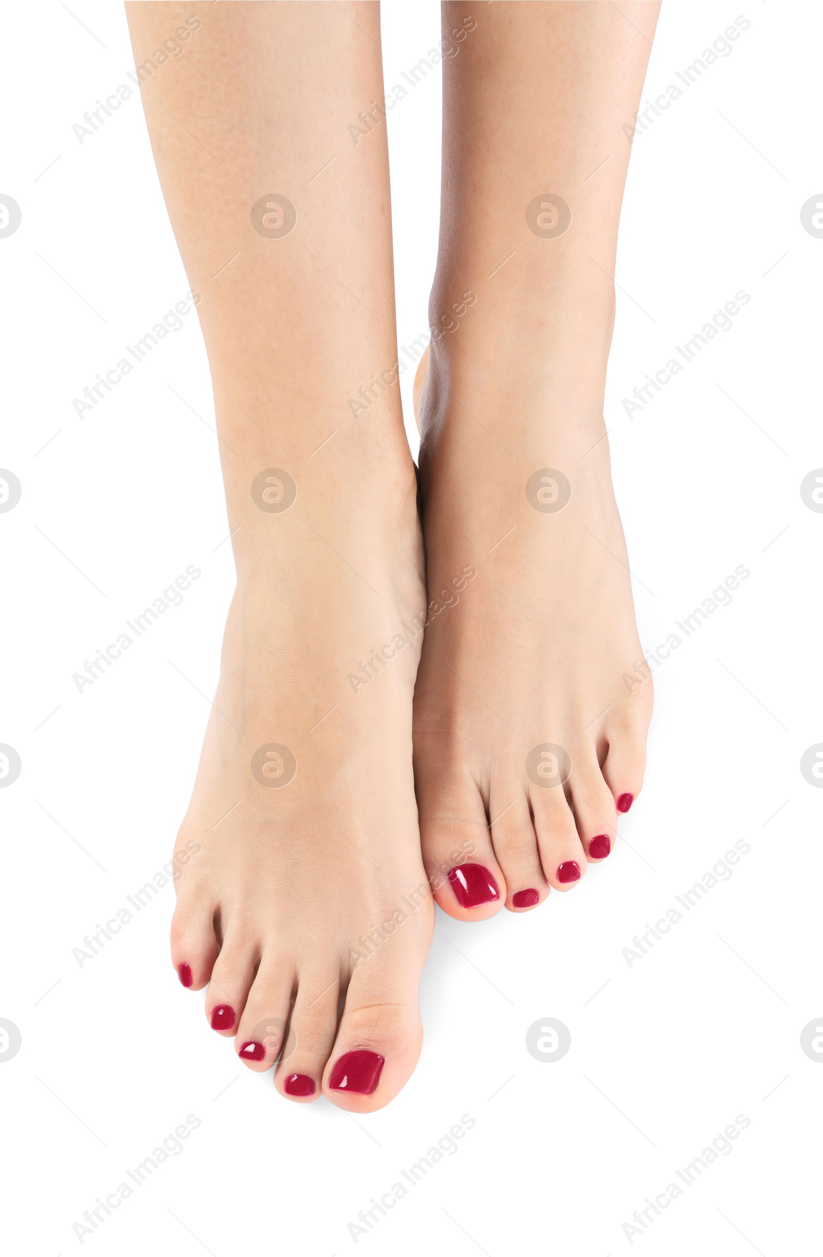 Image of Pedicure. Woman showing toenails covered with red nail polish on white background, closeup