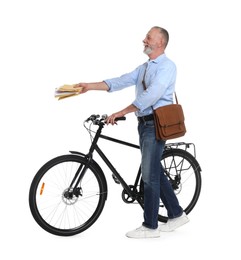 Happy postman with bicycle delivering letters on white background