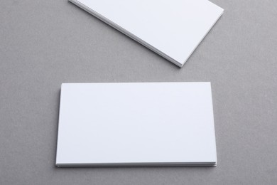 Photo of Blank business cards on grey background. Mockup for design