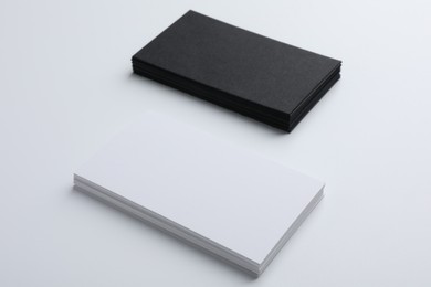 Photo of Blank business cards on light grey background. Mockup for design