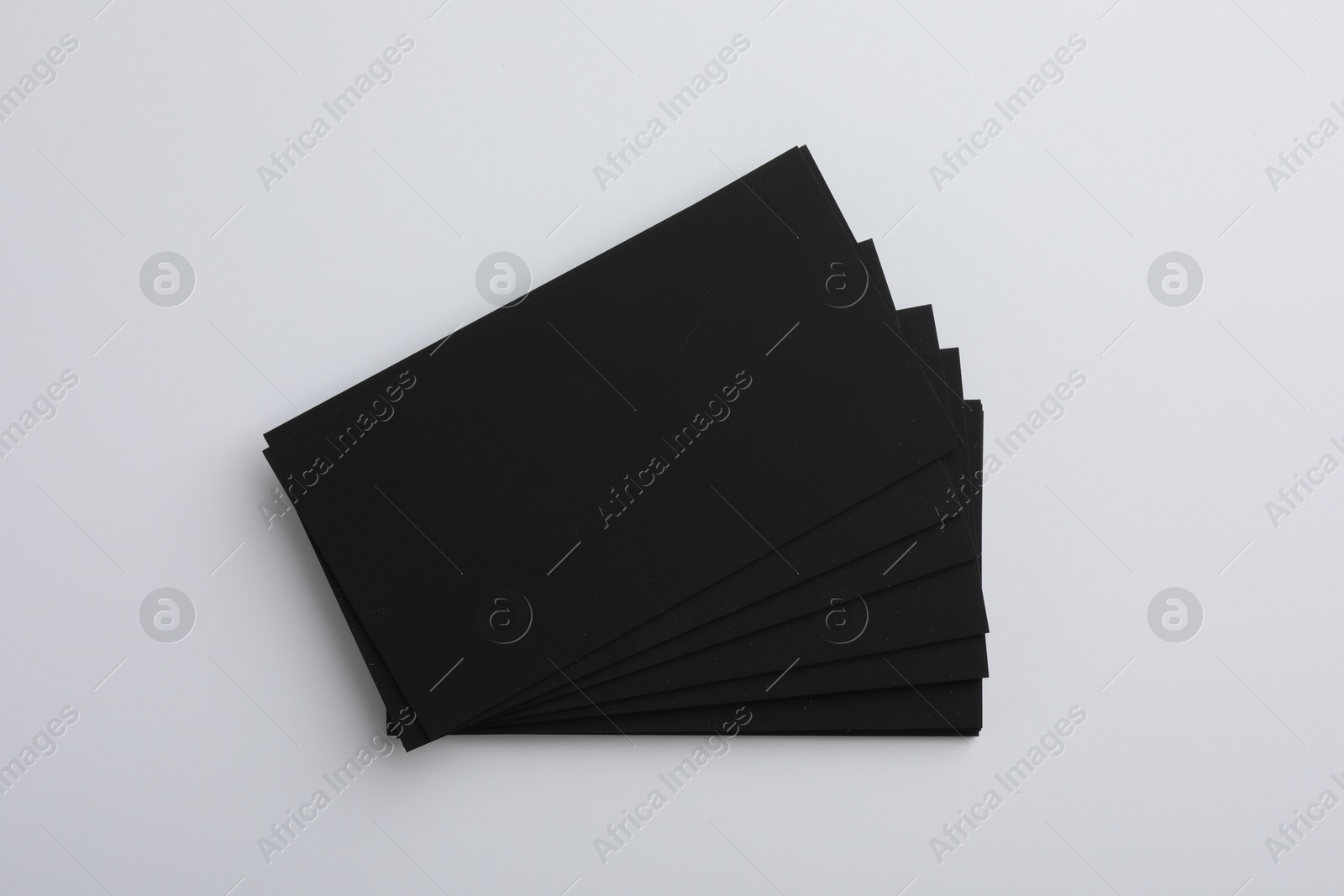 Photo of Blank business cards on light grey background, top view. Mockup for design