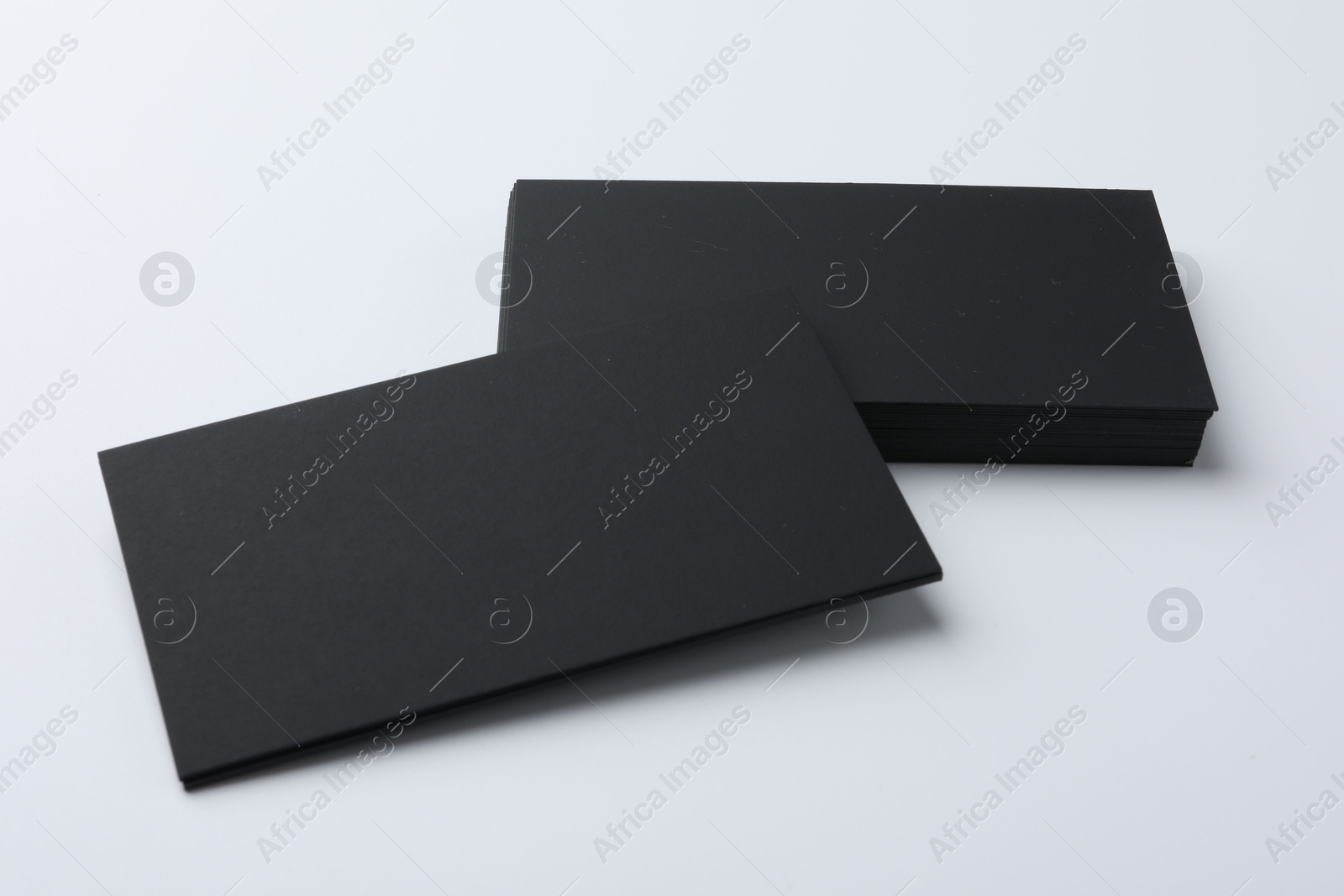 Photo of Blank business cards on light grey background. Mockup for design