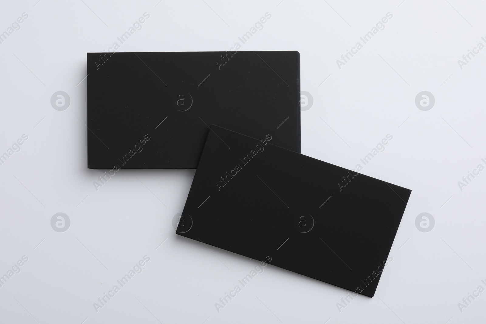 Photo of Blank business cards on light grey background, top view. Mockup for design