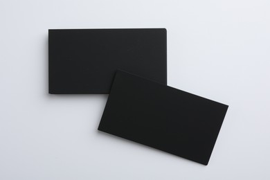 Blank business cards on light grey background, top view. Mockup for design