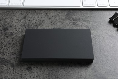 Photo of Blank business cards on grey textured table. Mockup for design