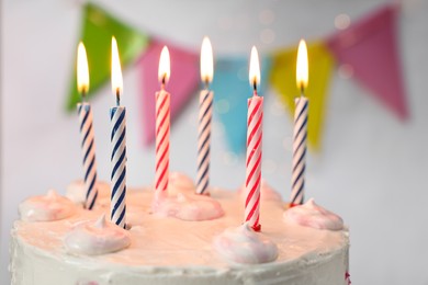 Tasty Birthday cake with burning candles against blurred background, closeup