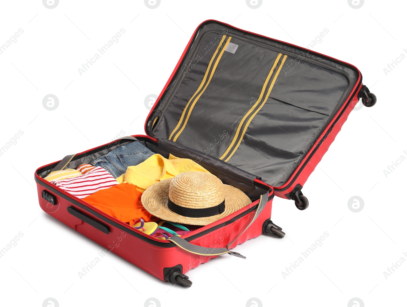 Photo of Open suitcase with clothes packed for travelling isolated on white