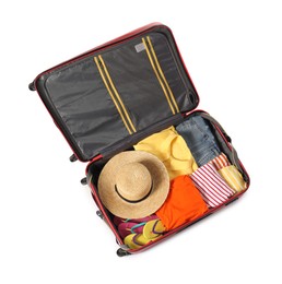 Photo of Open suitcase with clothes packed for travelling isolated on white, top view