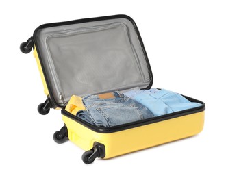 Photo of Open suitcase with clothes packed for travelling isolated on white