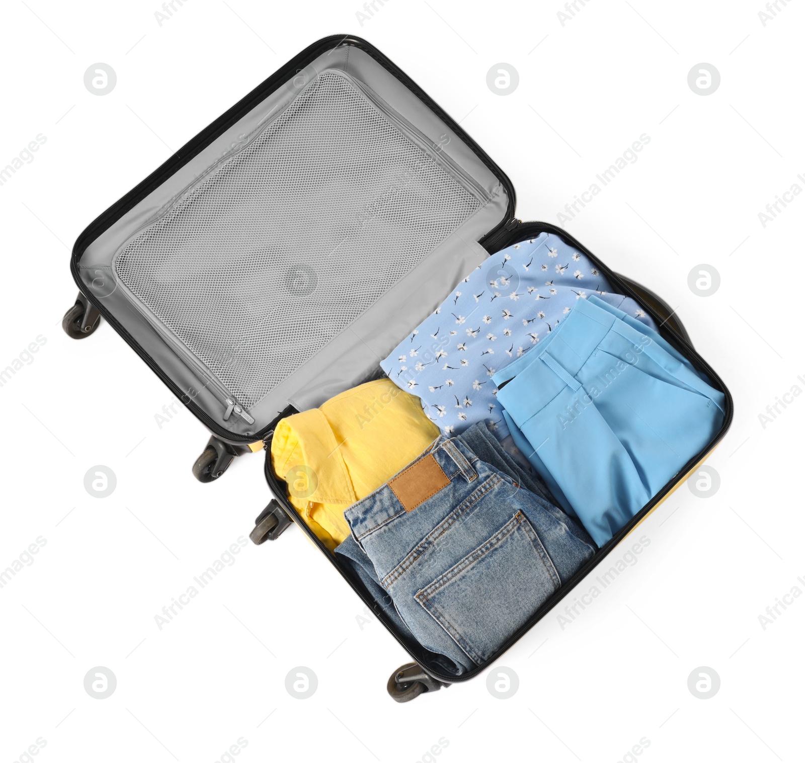 Photo of Open suitcase with clothes packed for travelling isolated on white, top view