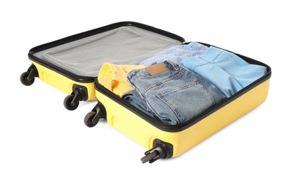 Photo of Open suitcase with clothes packed for travelling isolated on white