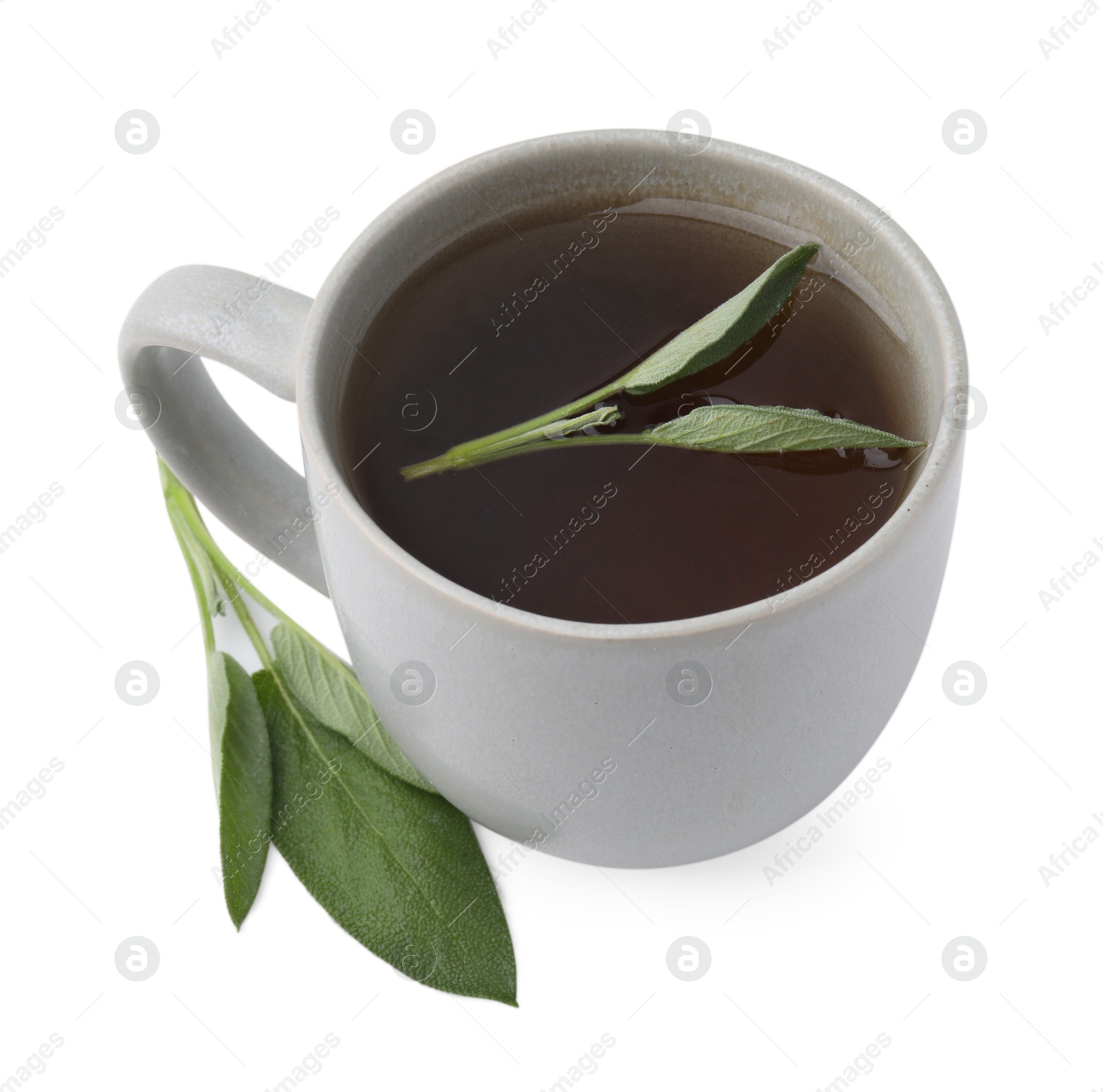 Photo of Aromatic herbal tea in cup with sage isolated on white