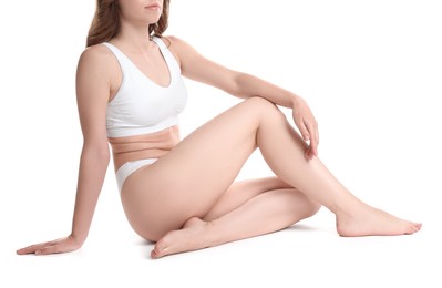 Woman with slim body posing on white background, closeup