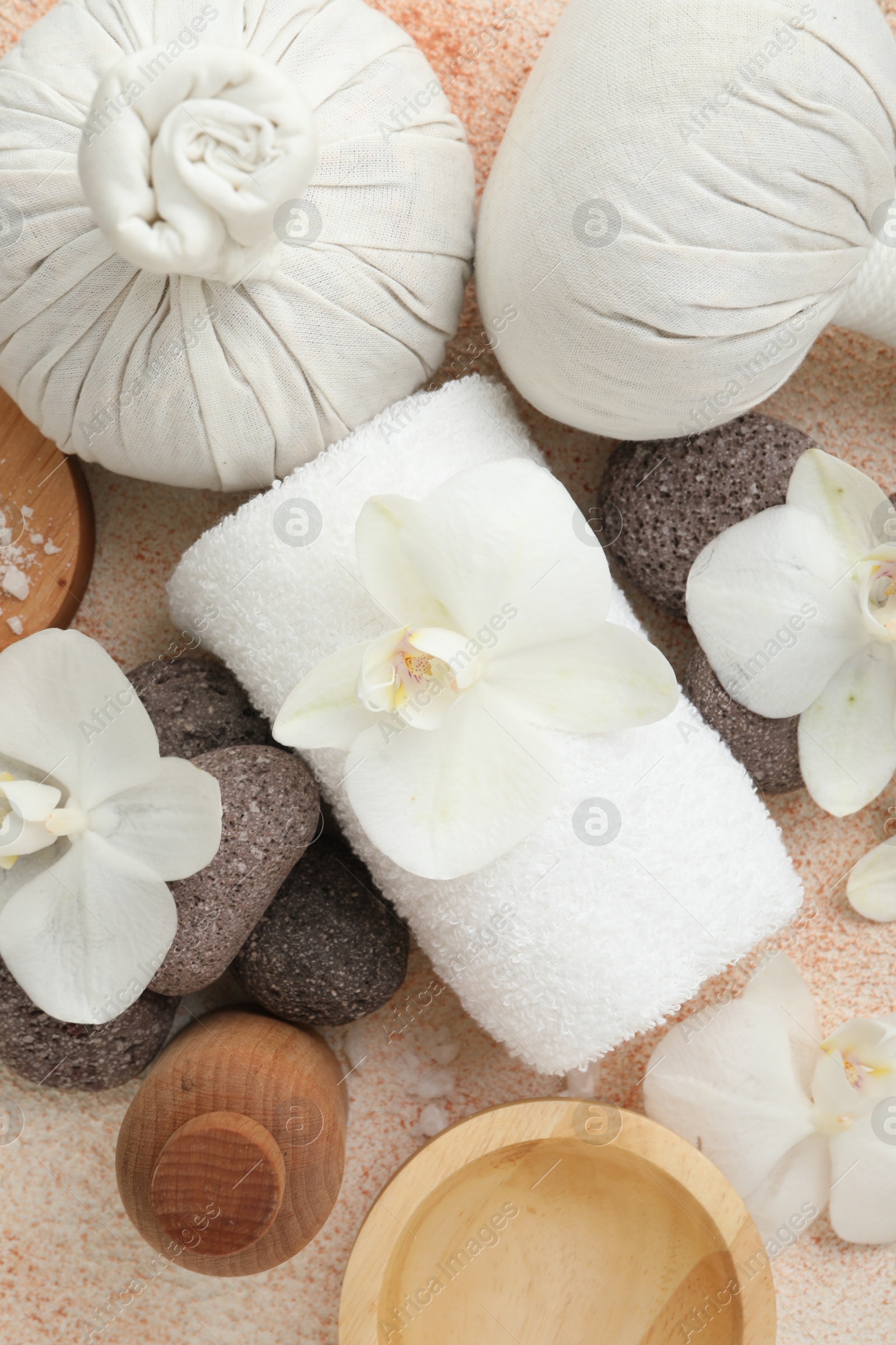 Photo of Flat lay composition with different spa products on beige textured background