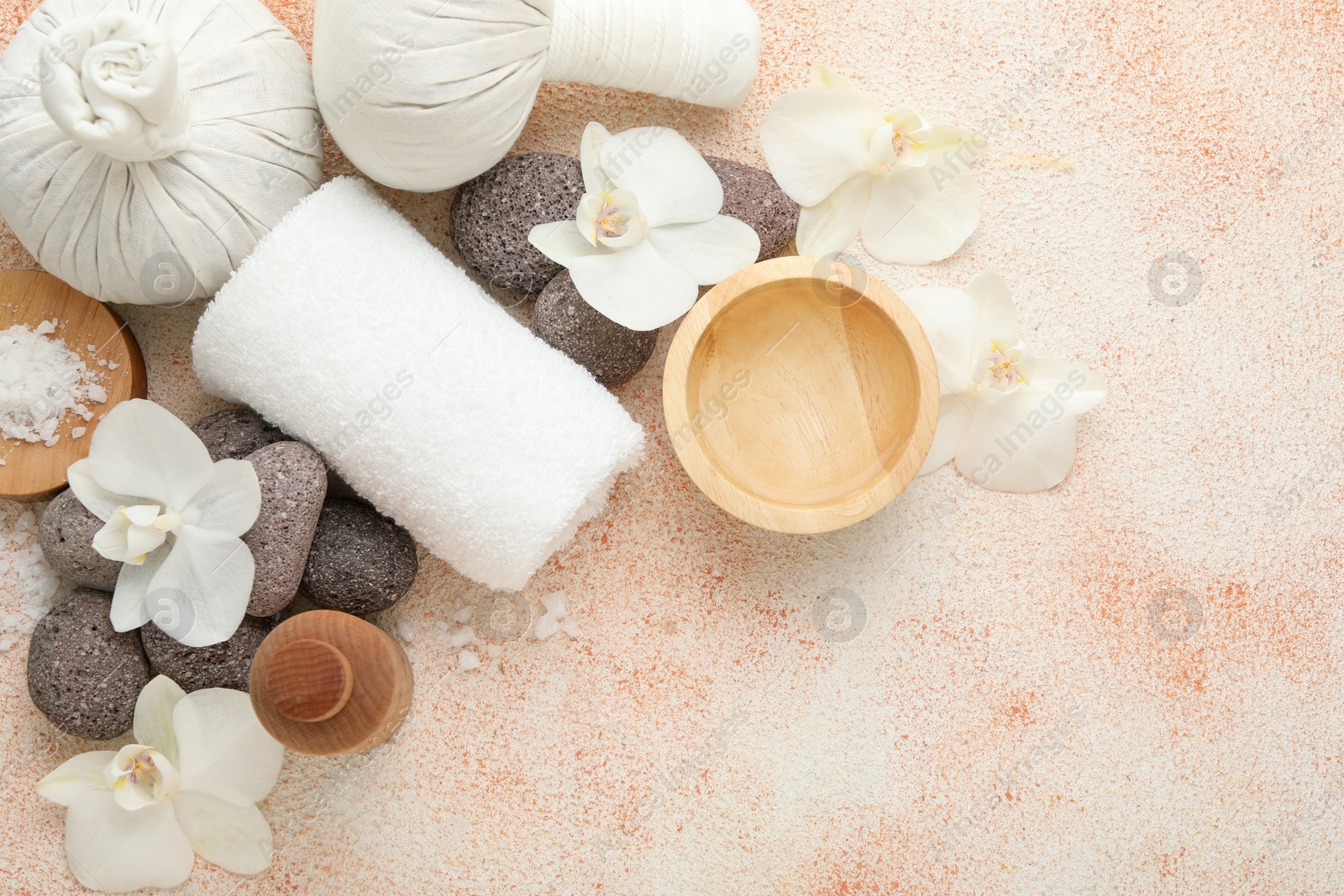 Photo of Flat lay composition with different spa products on beige textured background