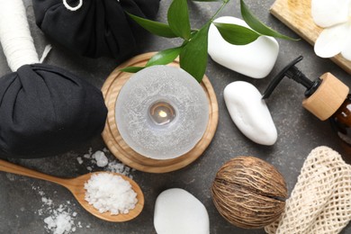 Photo of Flat lay composition with different spa products on grey textured table