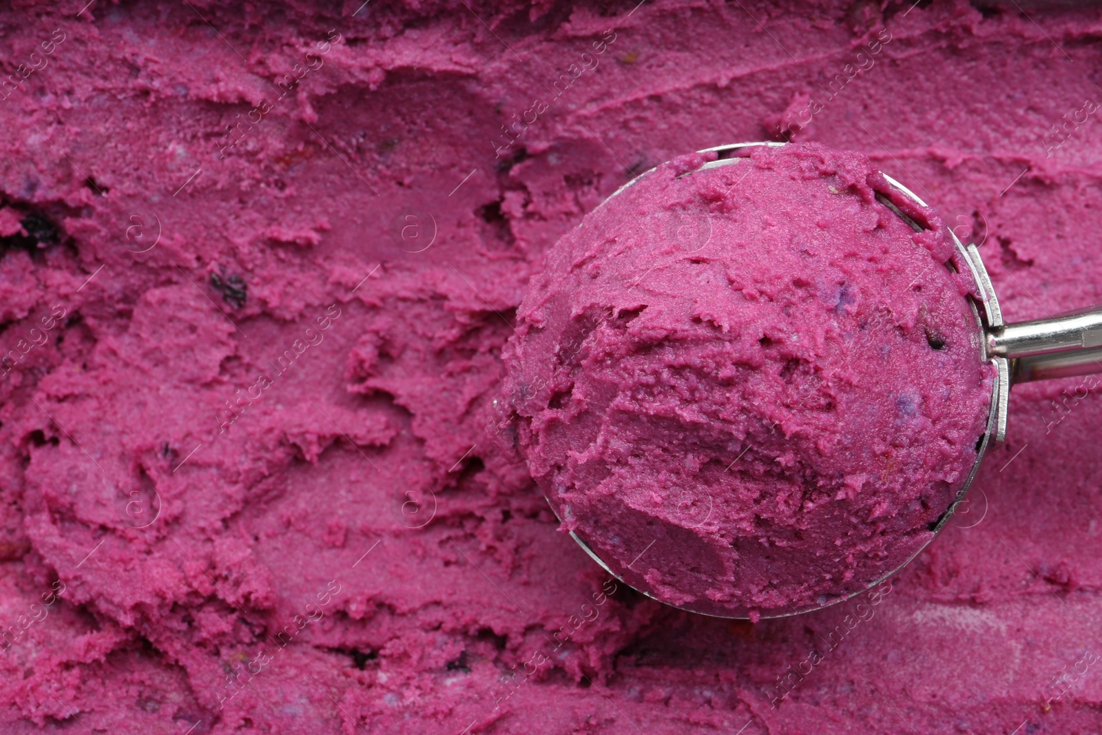 Photo of Scoop of tasty berry sorbet, closeup. Space for text