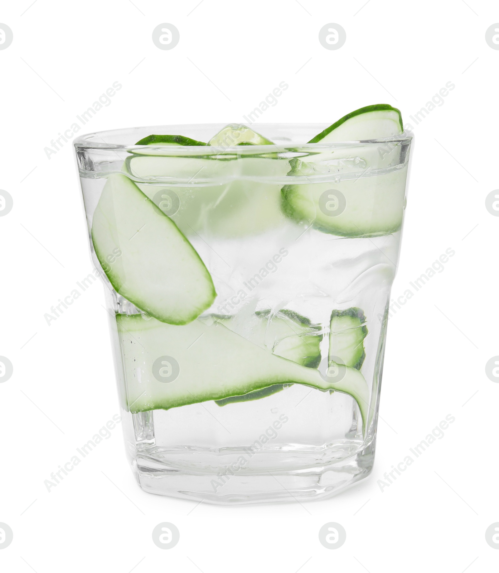 Photo of Refreshing water with sliced cucumber and lime in glass isolated on white