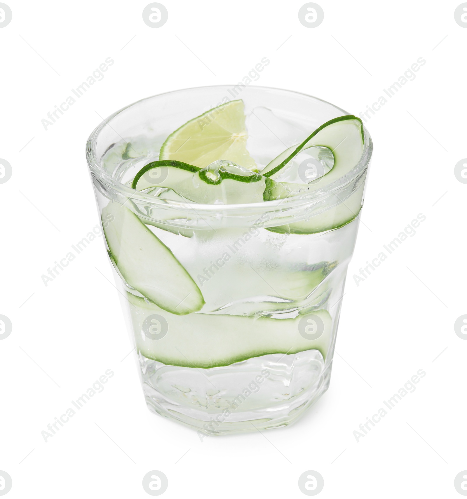 Photo of Refreshing water with sliced cucumber and lime in glass isolated on white