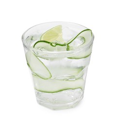 Photo of Refreshing water with sliced cucumber and lime in glass isolated on white