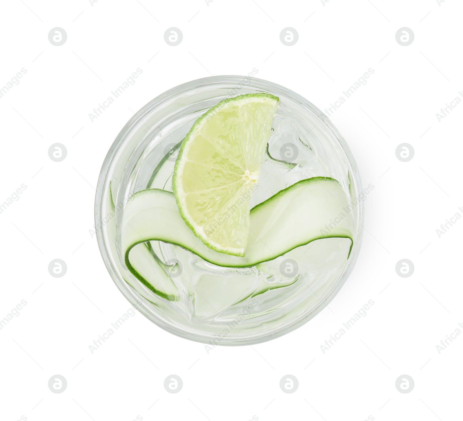 Photo of Refreshing water with sliced cucumber and lime in glass isolated on white, top view