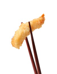 Photo of Chopsticks with delicious breaded fried shrimp isolated on white