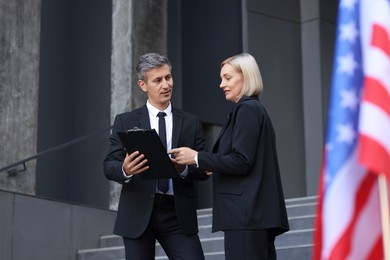 Photo of International relations. Diplomats talking during meeting outdoors