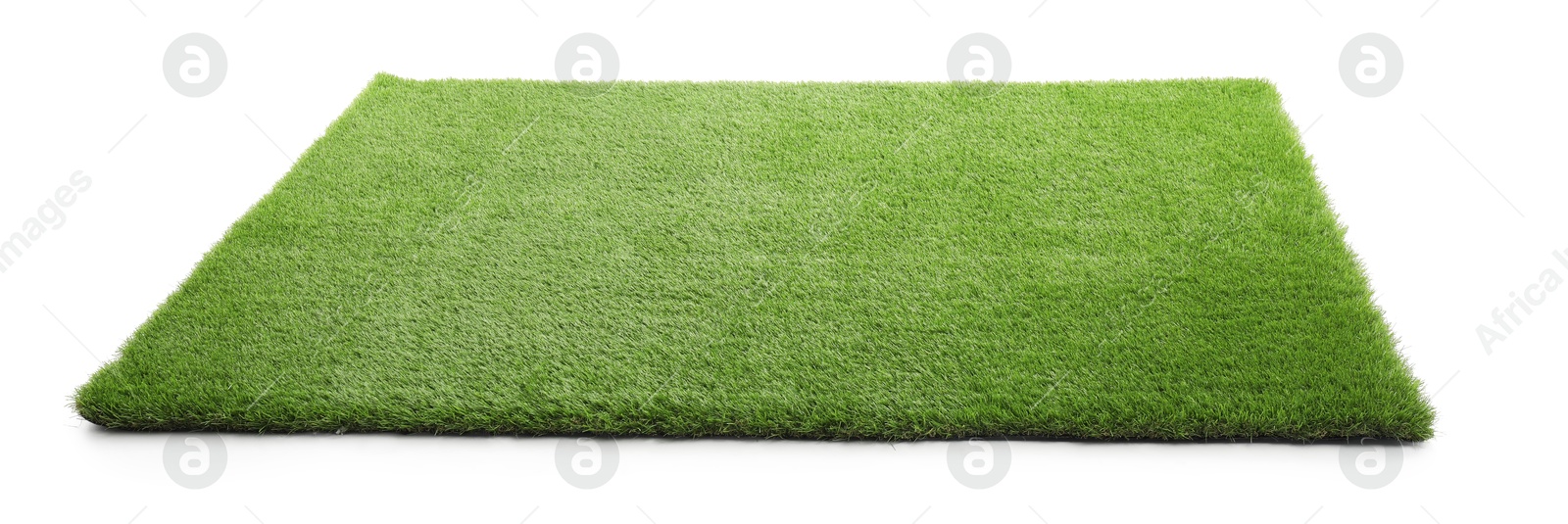 Photo of Green artificial grass isolated on white. Garden decor