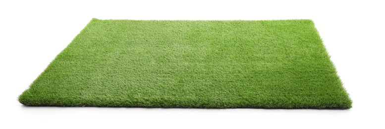 Green artificial grass isolated on white. Garden decor