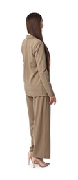 Woman in beige suit on white background