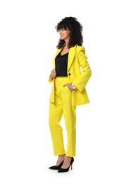 Photo of Beautiful young woman in stylish yellow suit isolated on white