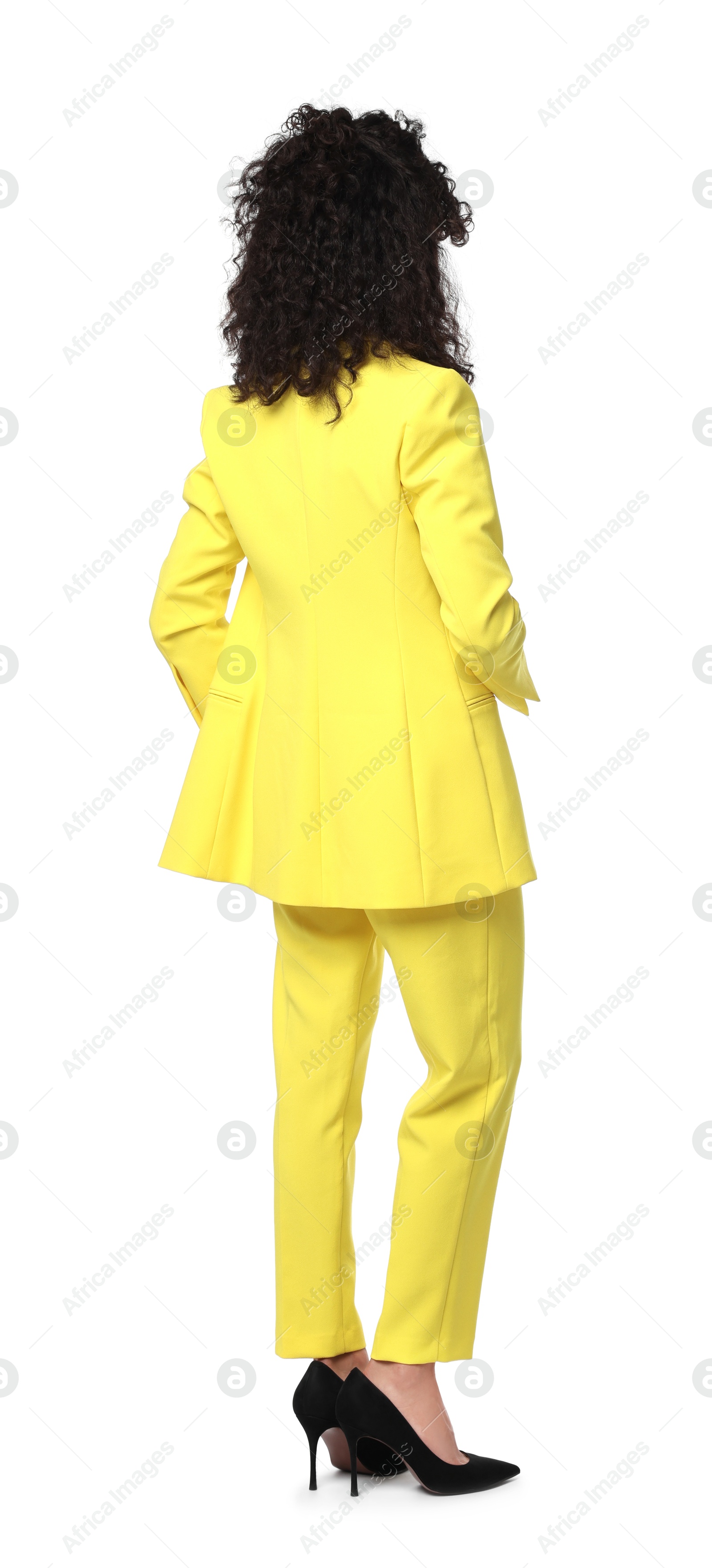 Photo of Woman in stylish yellow suit isolated on white