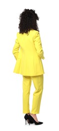 Photo of Woman in stylish yellow suit isolated on white
