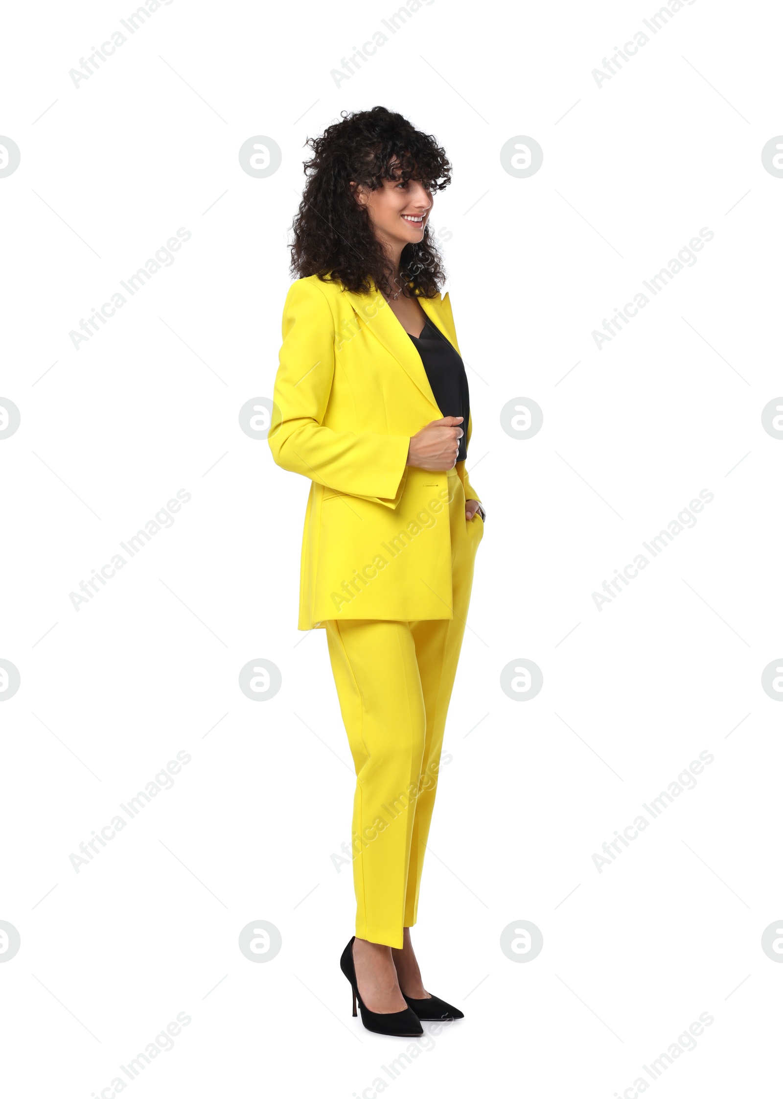 Photo of Beautiful young woman in stylish yellow suit isolated on white