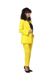 Photo of Beautiful young woman in stylish yellow suit isolated on white