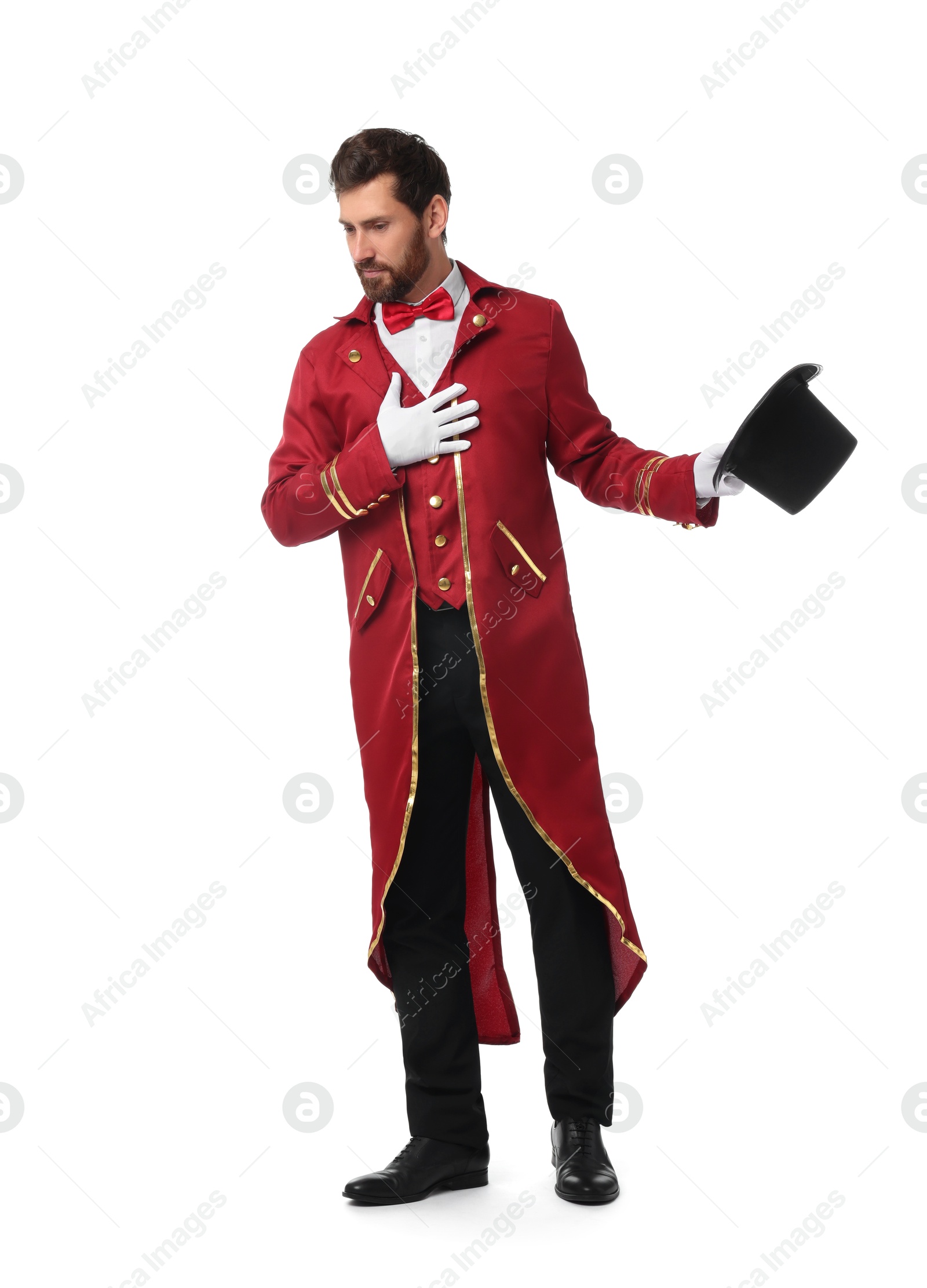 Photo of Portrait of showman in red costume and hat on white background