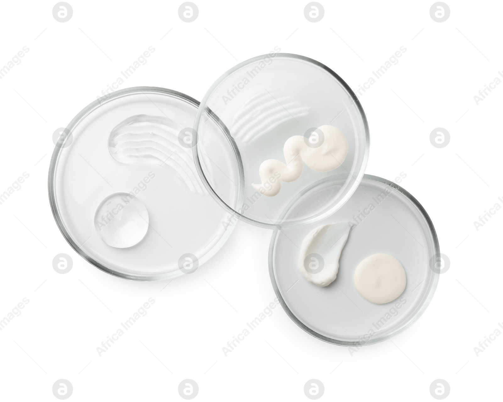 Photo of Petri dishes with different cosmetic products isolated on white, flat lay